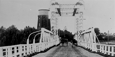 Swan Hill bridge with woman on horseback and a horse and buggy crossing. Approx 1910. Image courtesy of the State Library of South Australia, PRG 1258/2/1916.